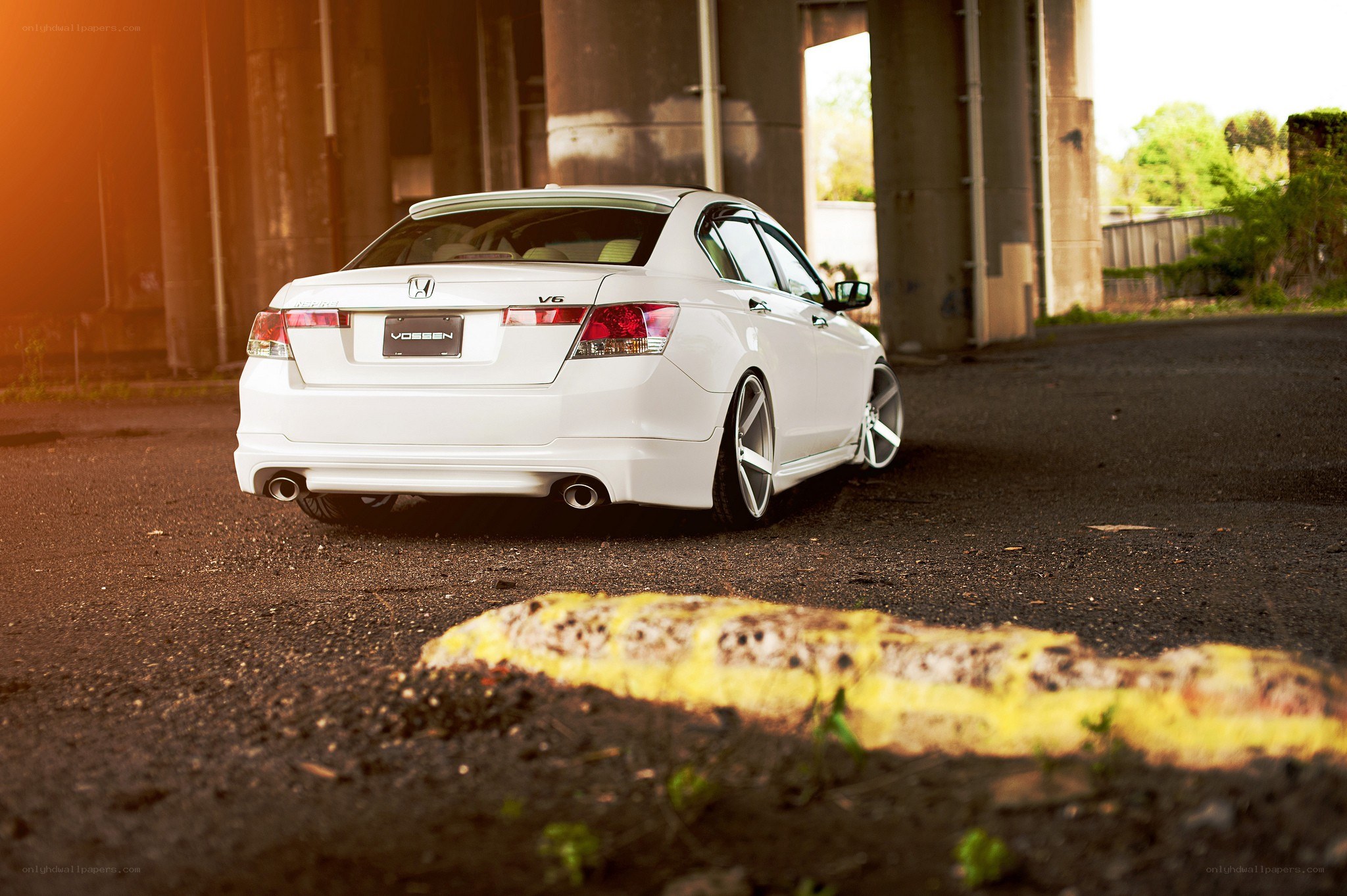 White Honda Accord under overpass