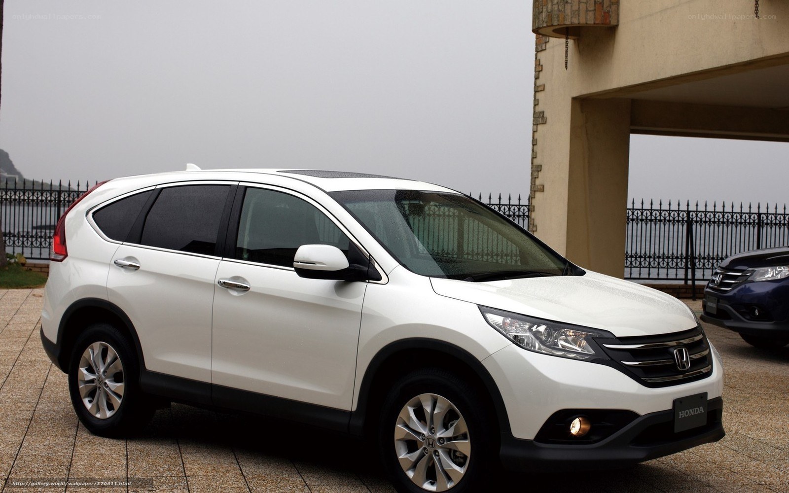 white honda cr-v parked outside