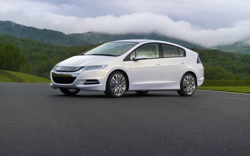 White Honda Insight on a road