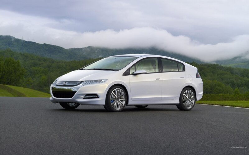 White Honda Insight on a road