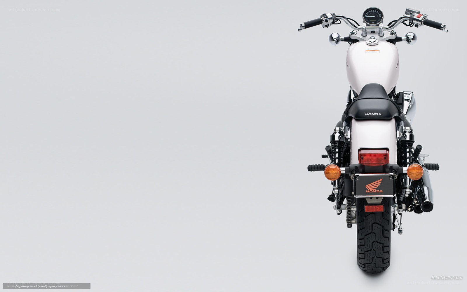 white honda motorcycle rear view