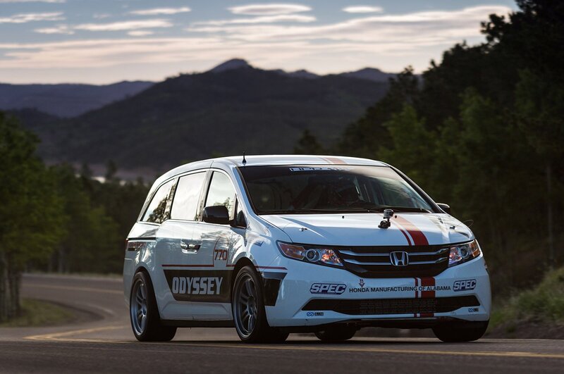 White Honda Odyssey race car on road