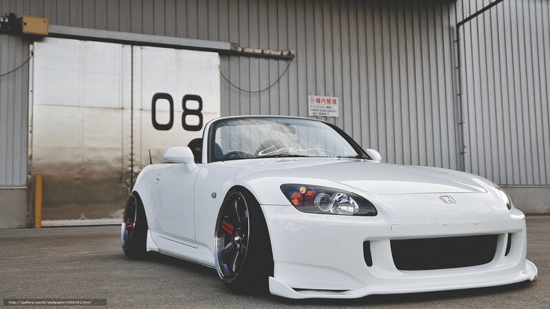 White Honda S2000 in front of garage