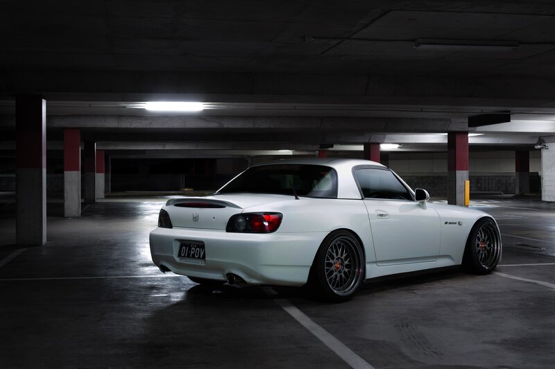 White Honda S2000 in parking garage