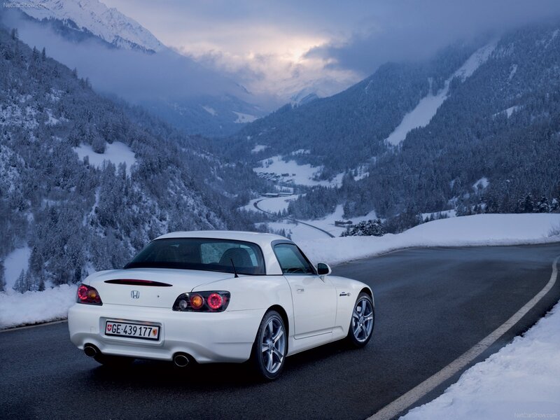 White Honda S2000 on snowy mountain road