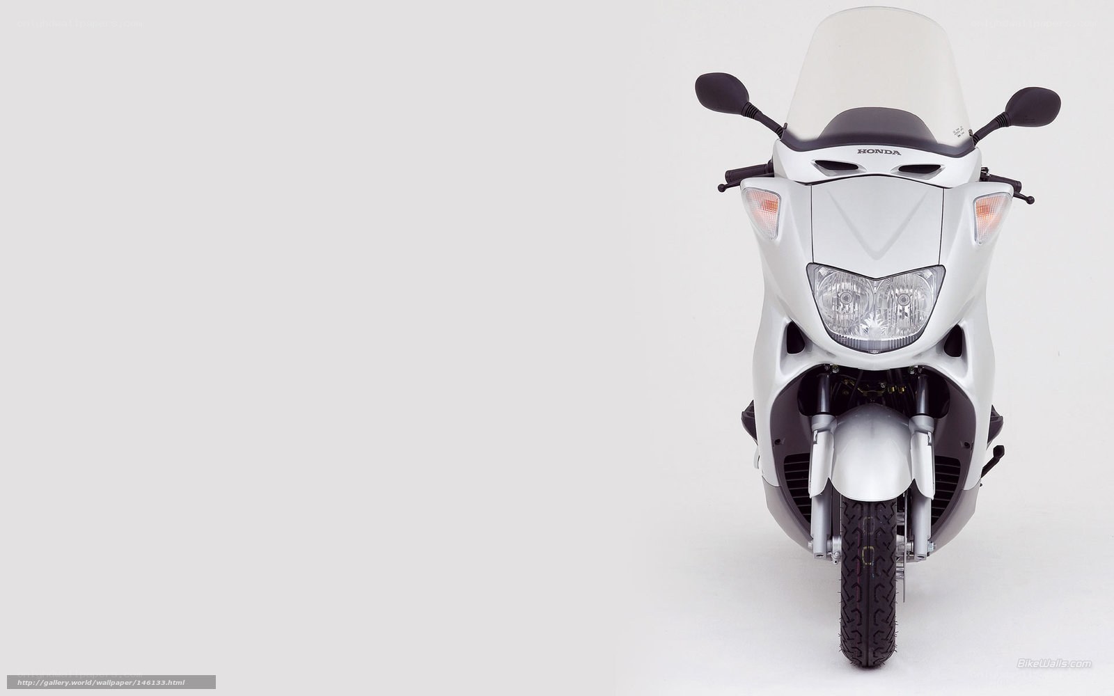 White Honda scooter front view
