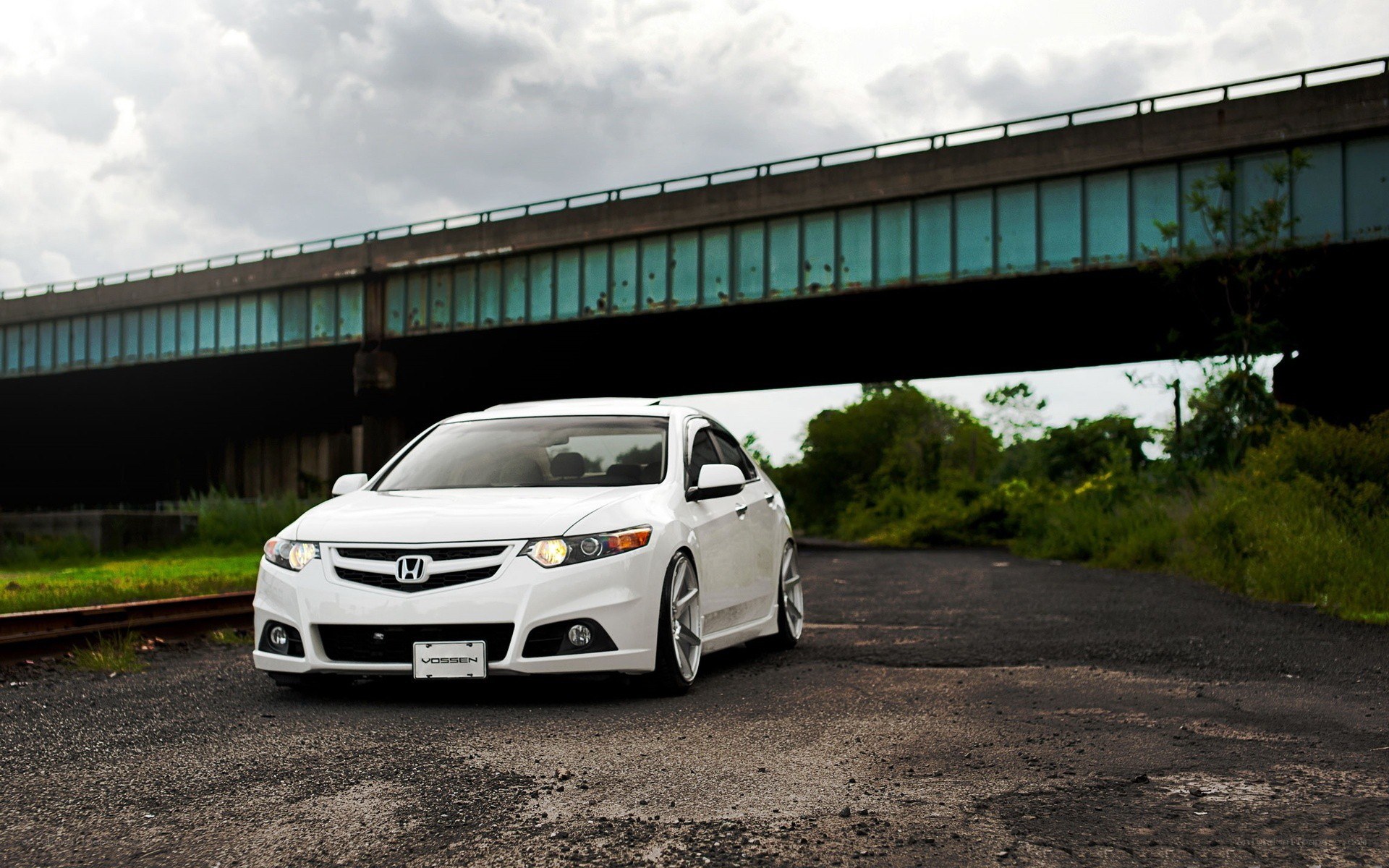 white honda under a bridge