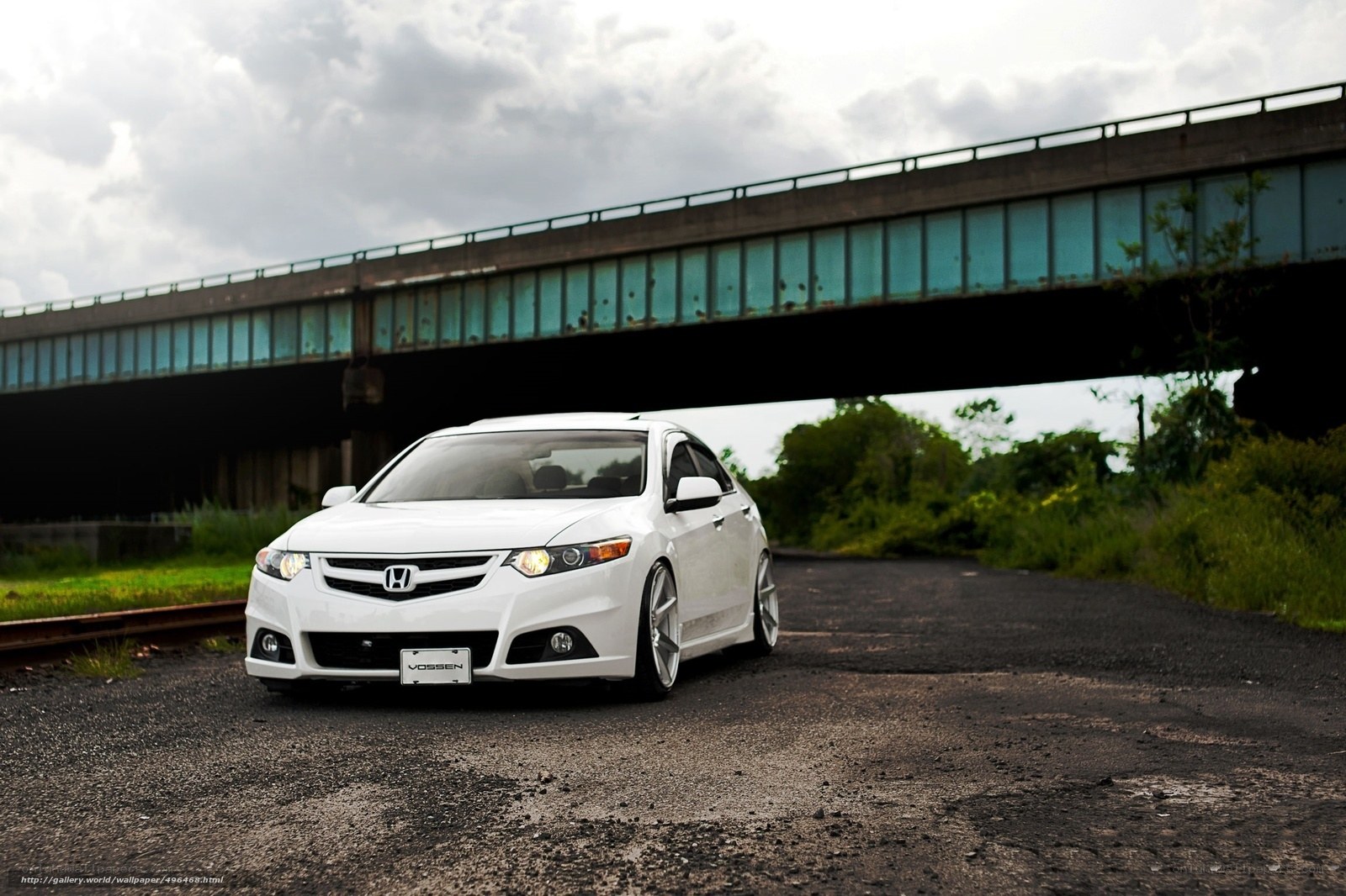 White Honda under a bridge