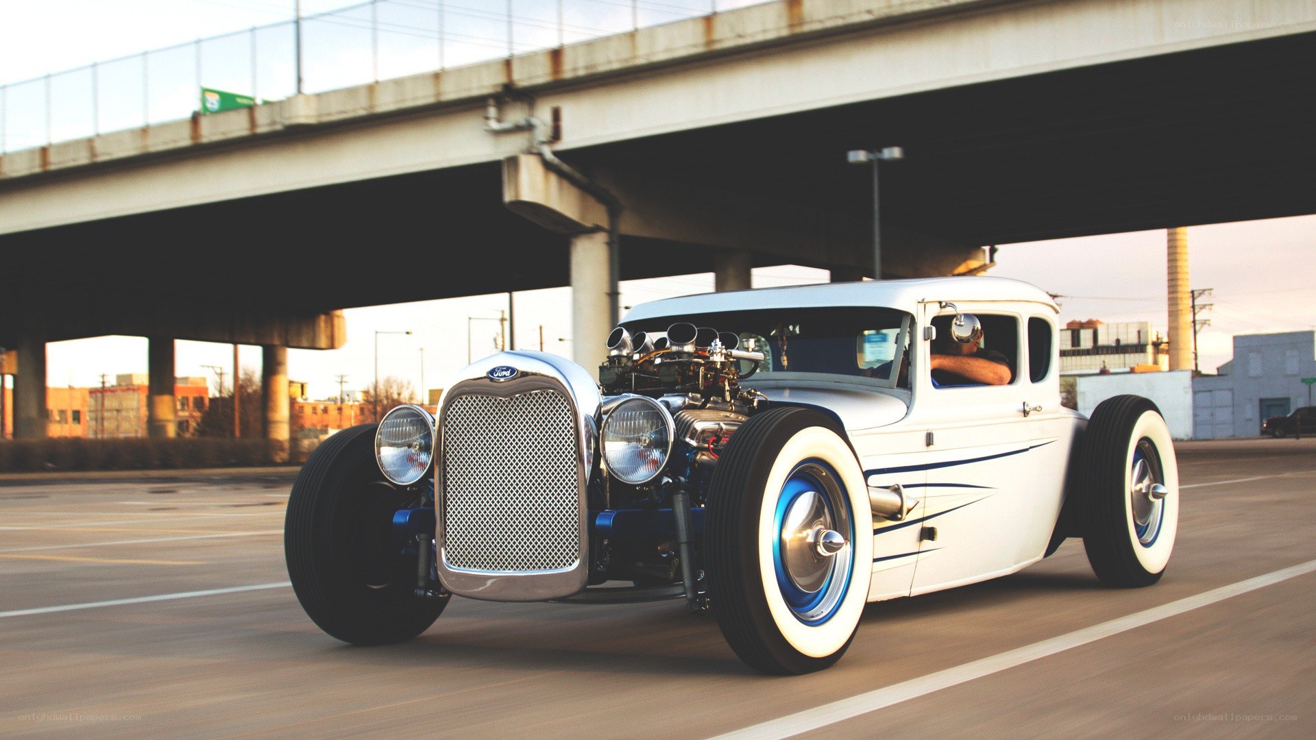 white hot rod under bridge