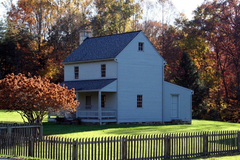 White house in autumn landscape