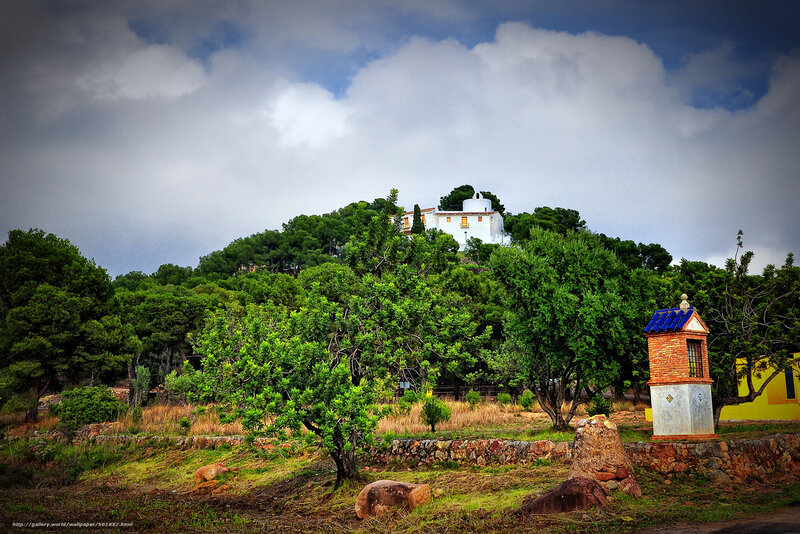 White house on a green hill