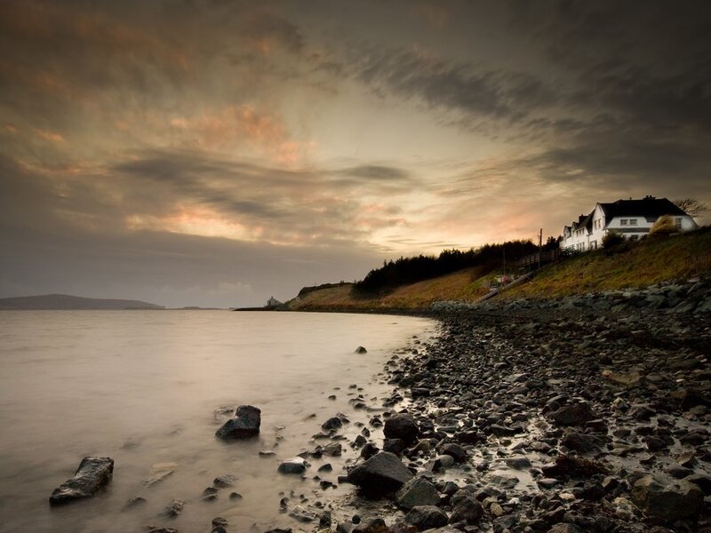 White House on Rocky Shore — Dramatic