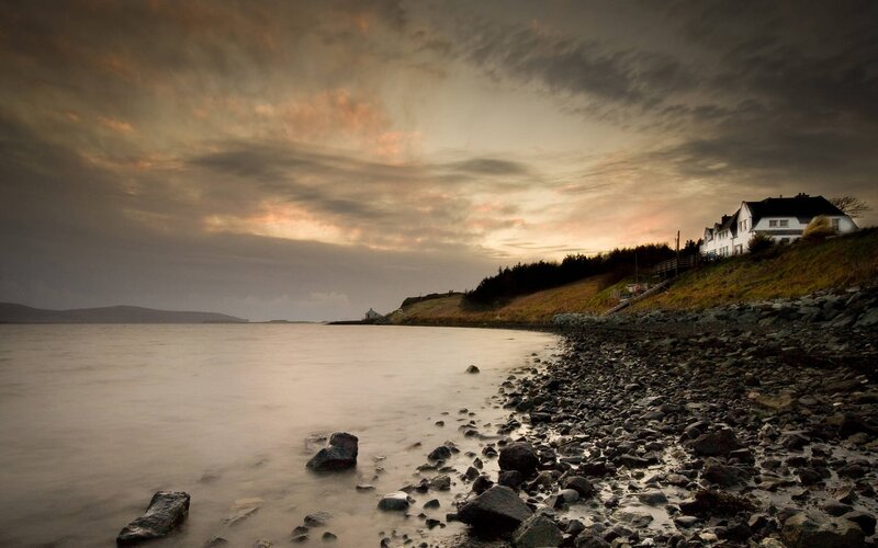 White House on Rocky Shore
