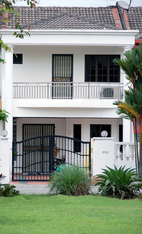 white house with black gate