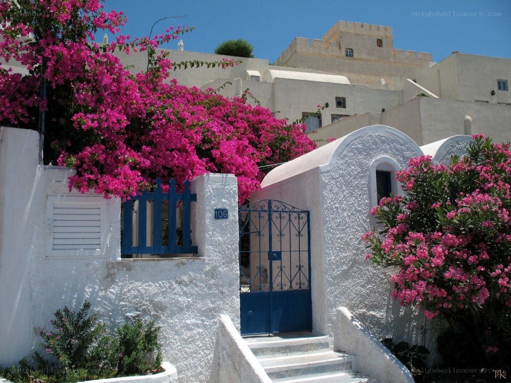 White house with pink flowers