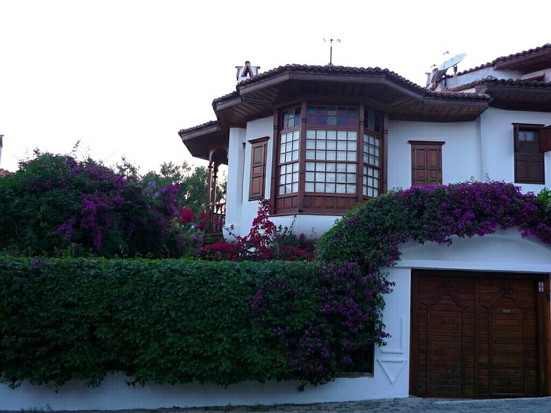 white house with purple flowers