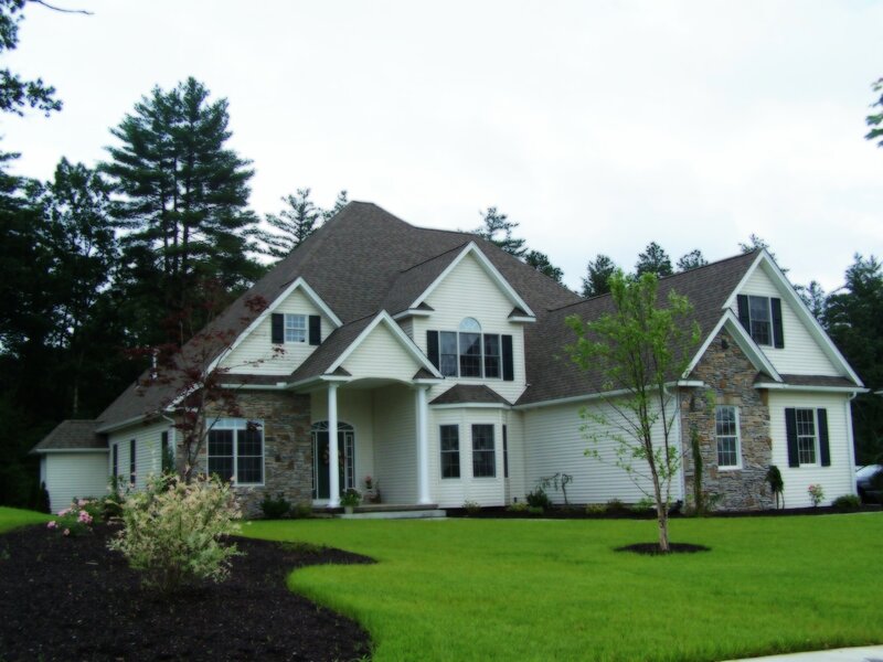 white house with stone accents