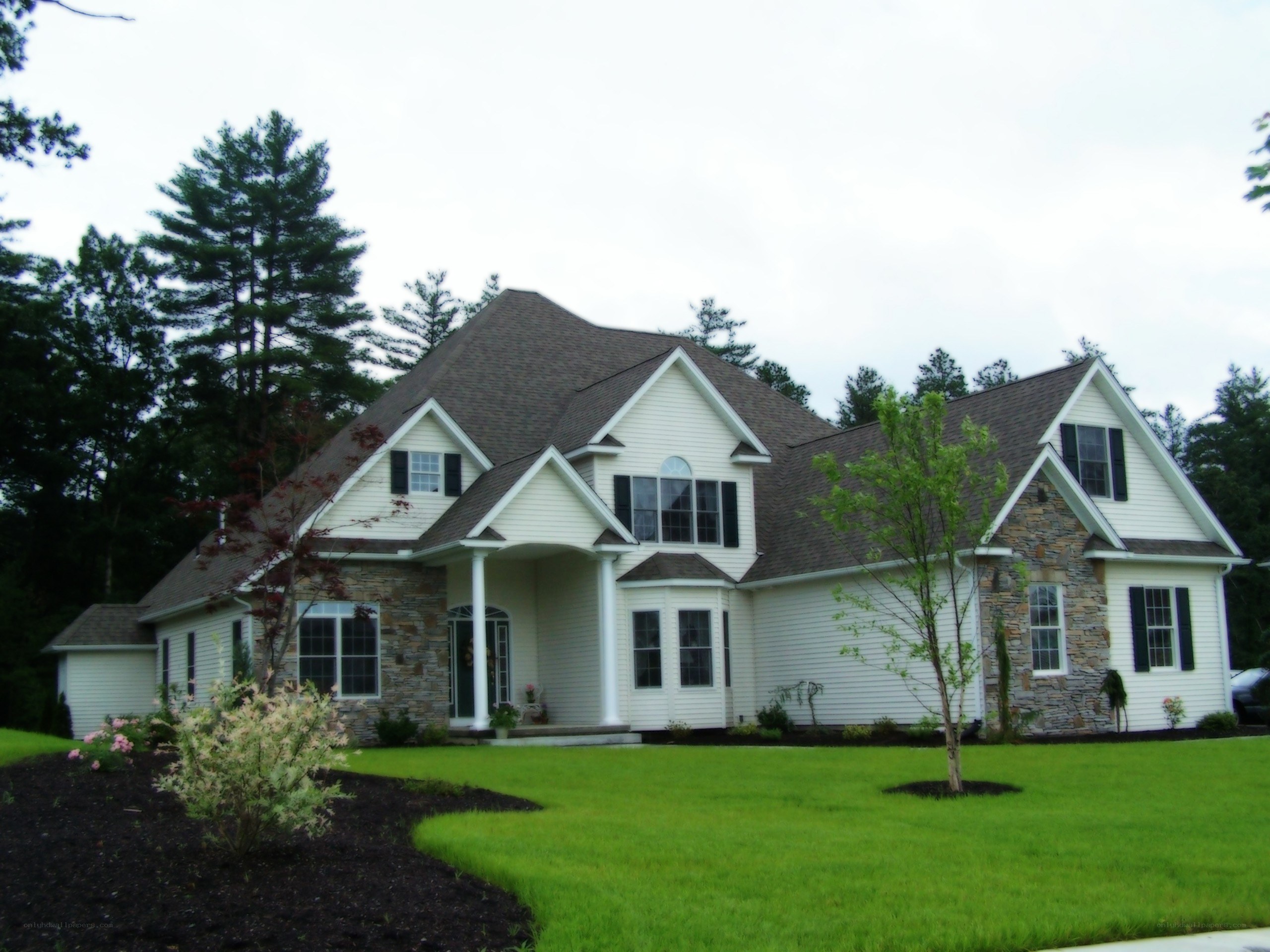 white house with stone accents