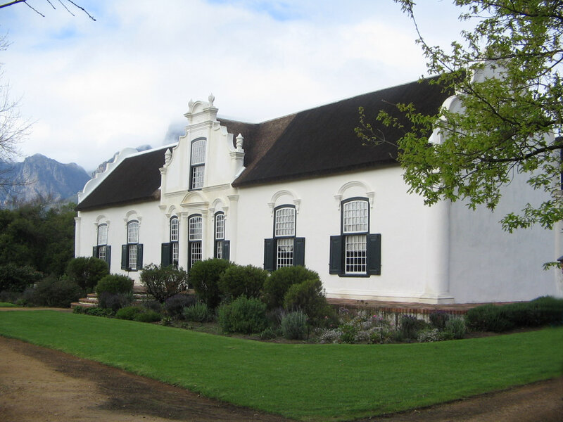 White house with thatched roof