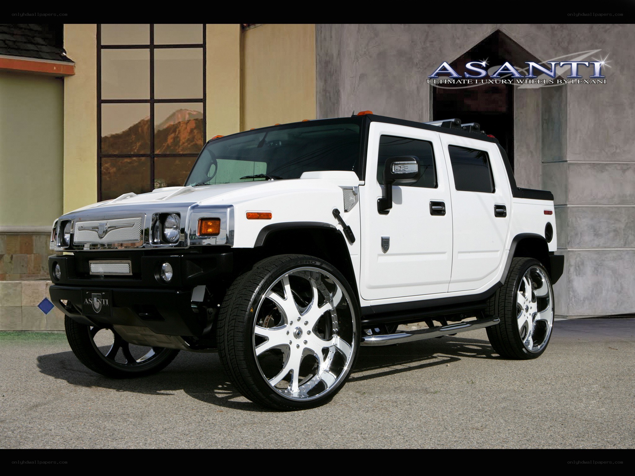 White Hummer H2 with custom wheels