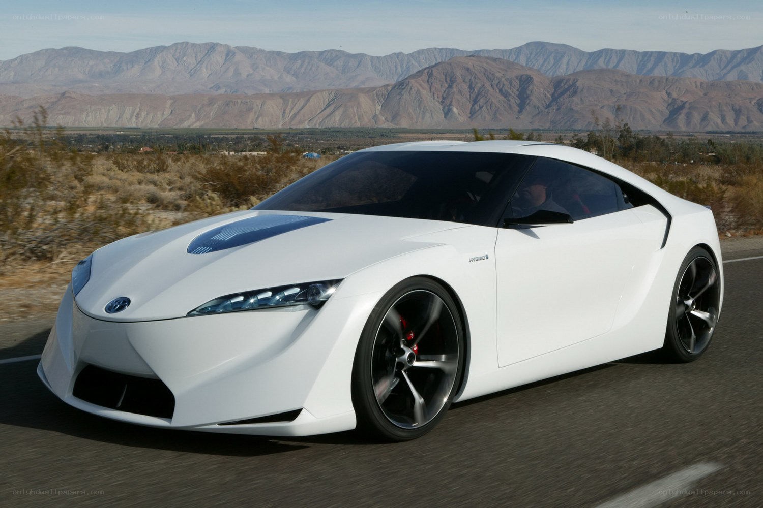 White hybrid concept car on road