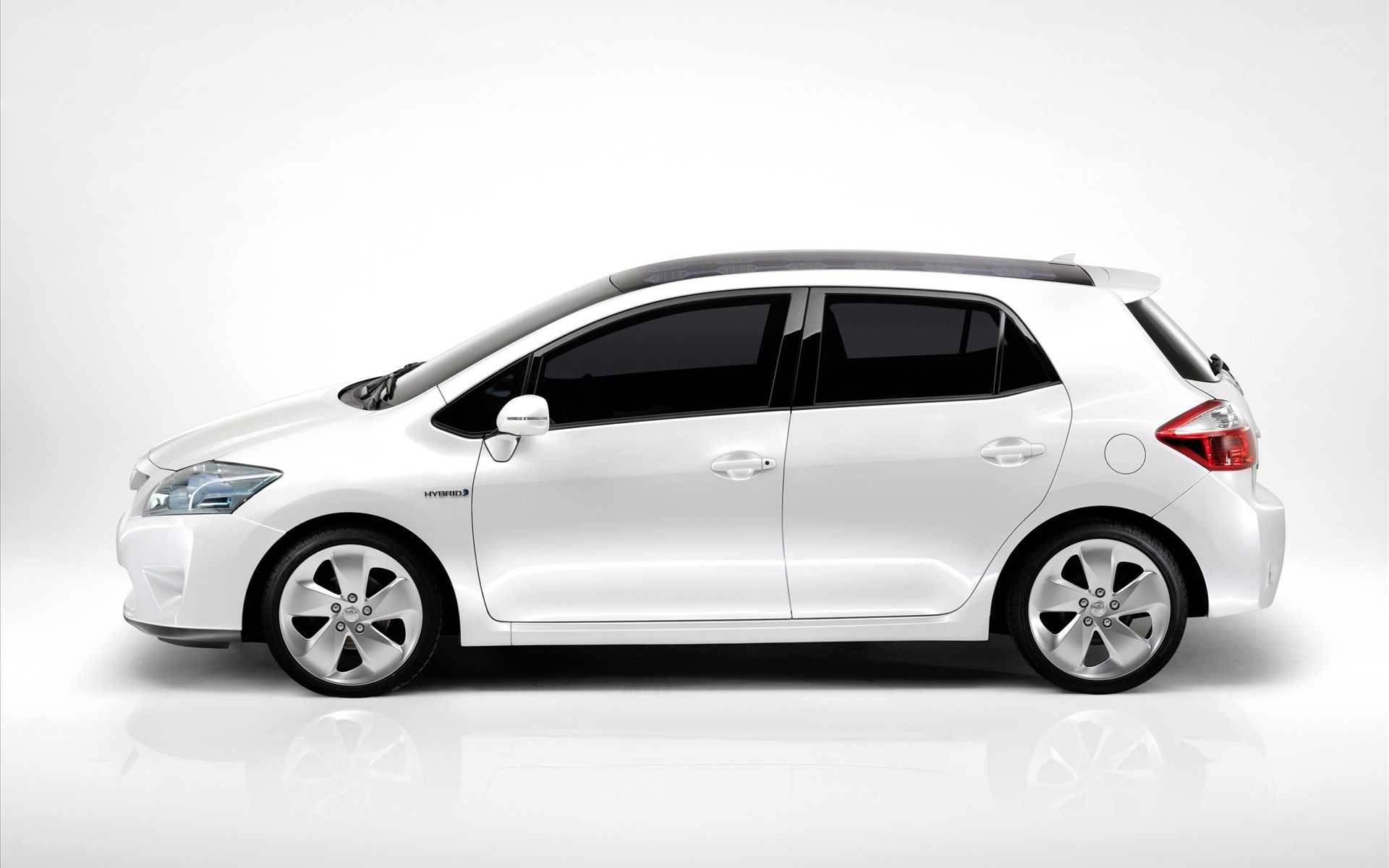 white hybrid hatchback car