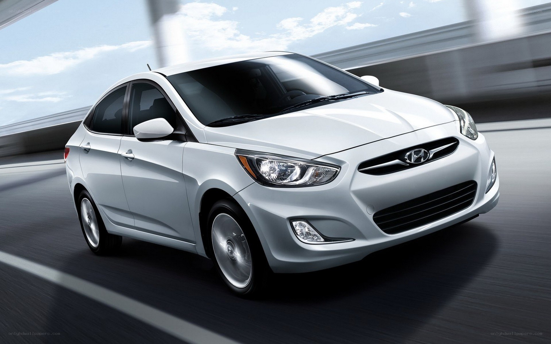 White Hyundai Accent in motion
