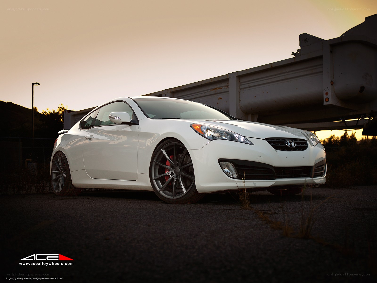 white hyundai coupe at sunset