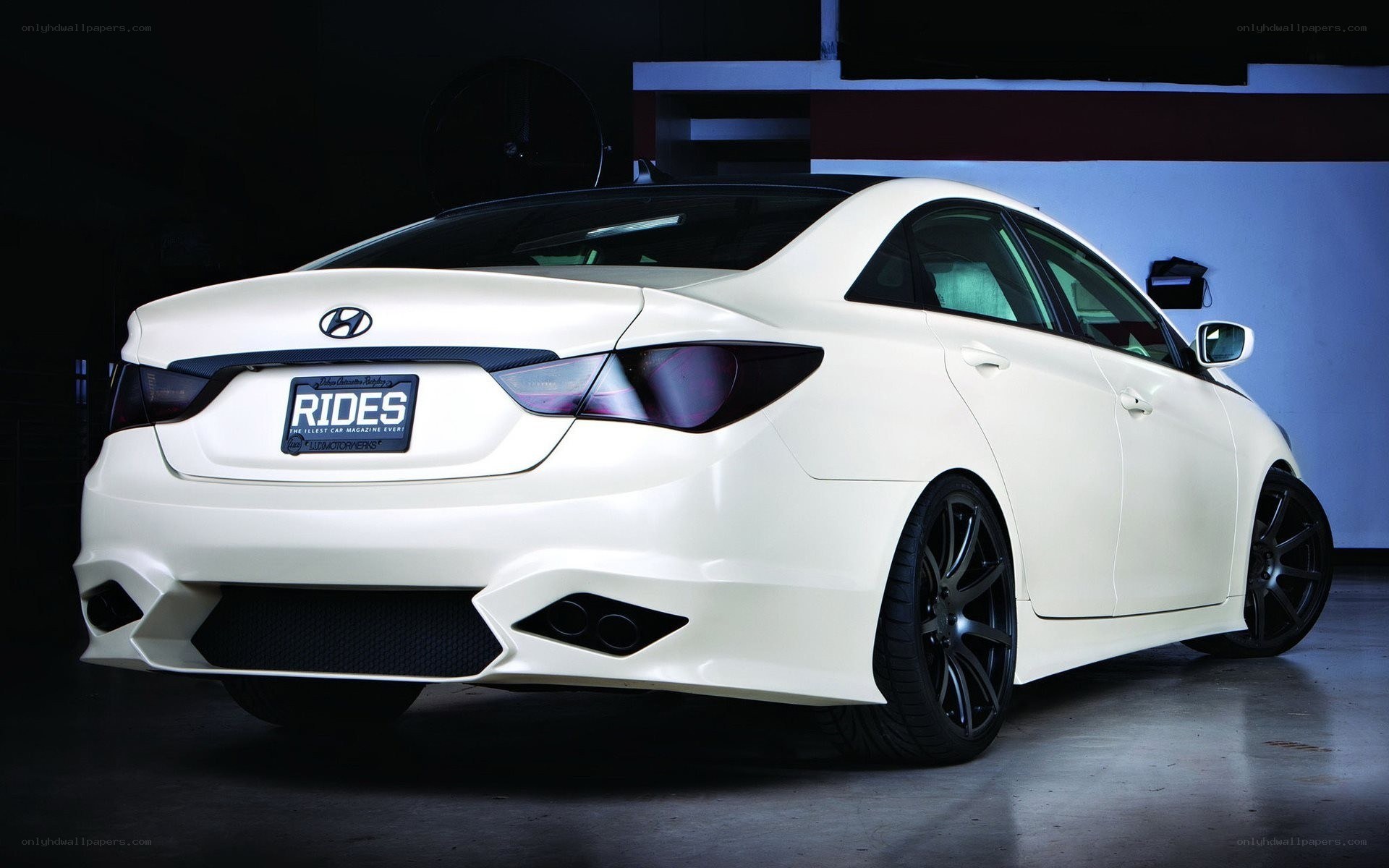 white hyundai sedan rear view