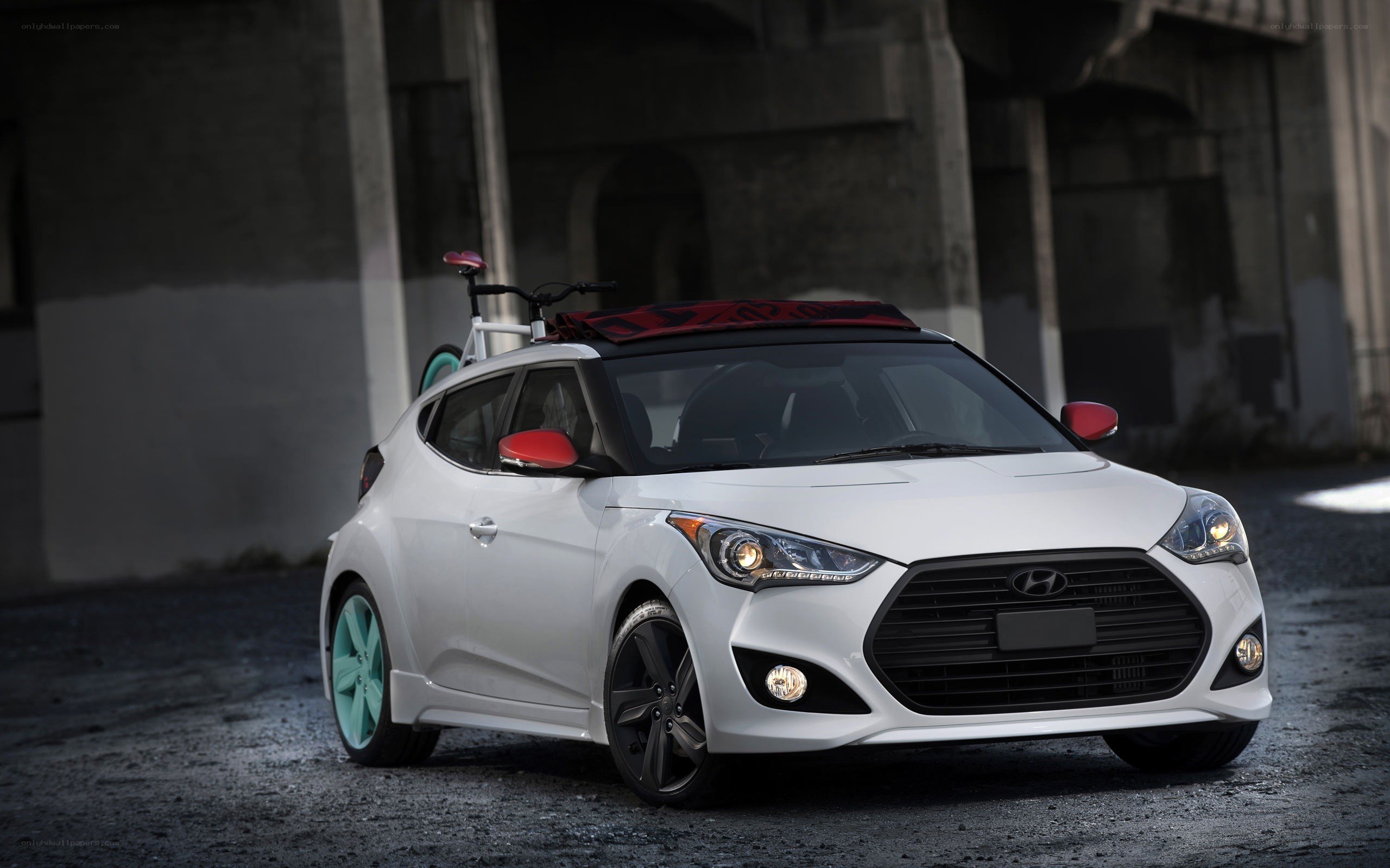 White Hyundai Veloster with custom wheels