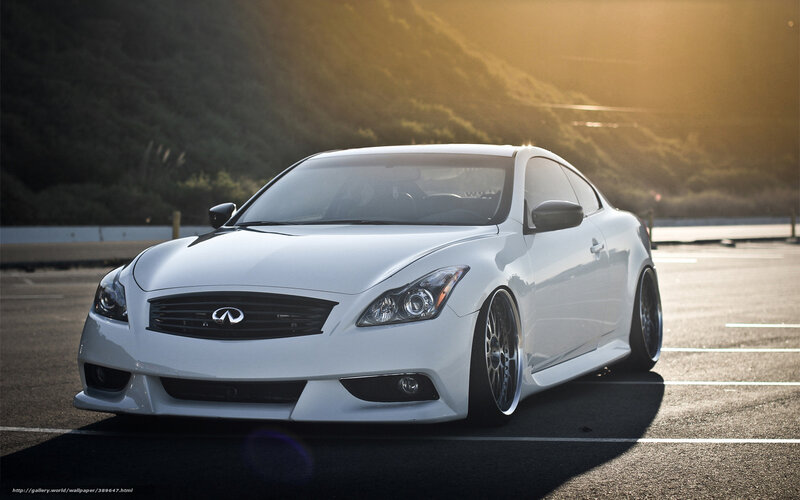 white infiniti coupe at sunset