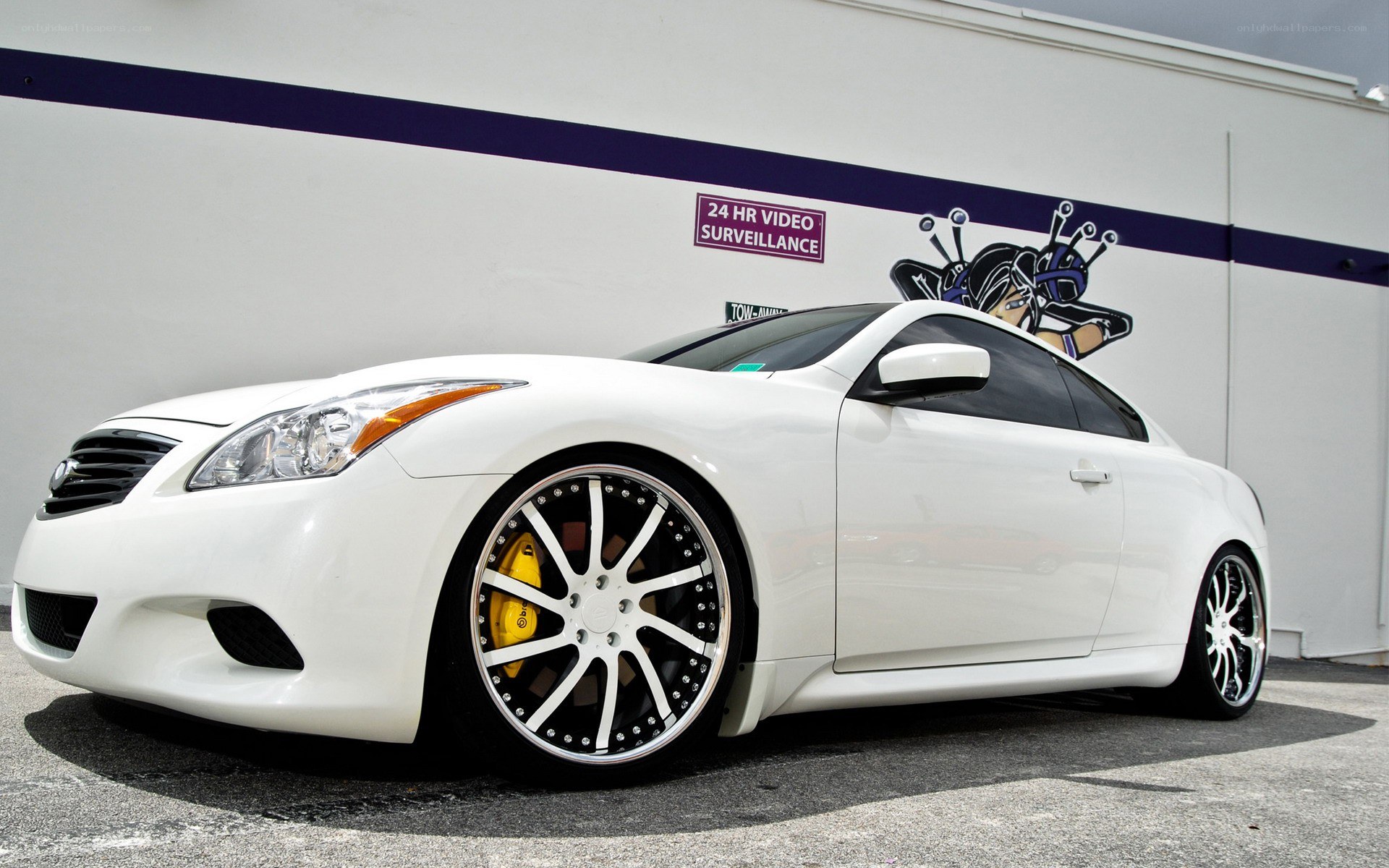 white infiniti coupe with custom wheels