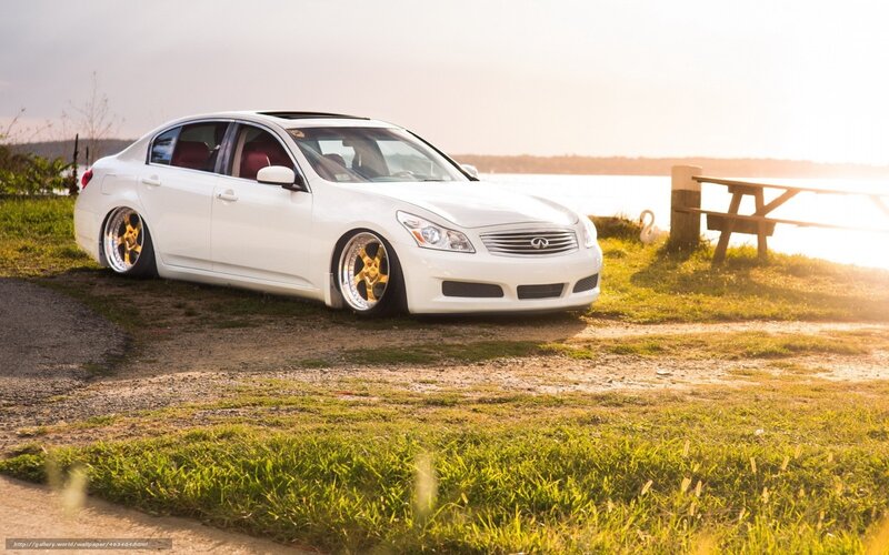 White Infiniti G37 by the water