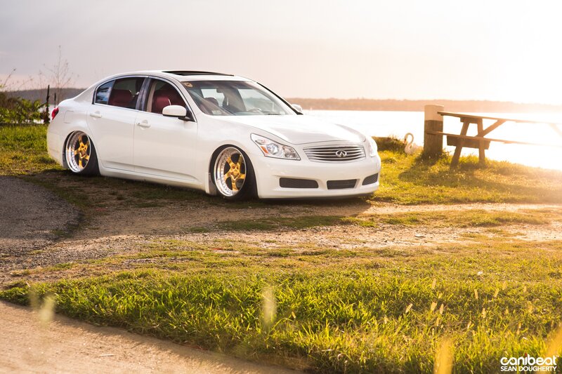 White Infiniti G37 by water