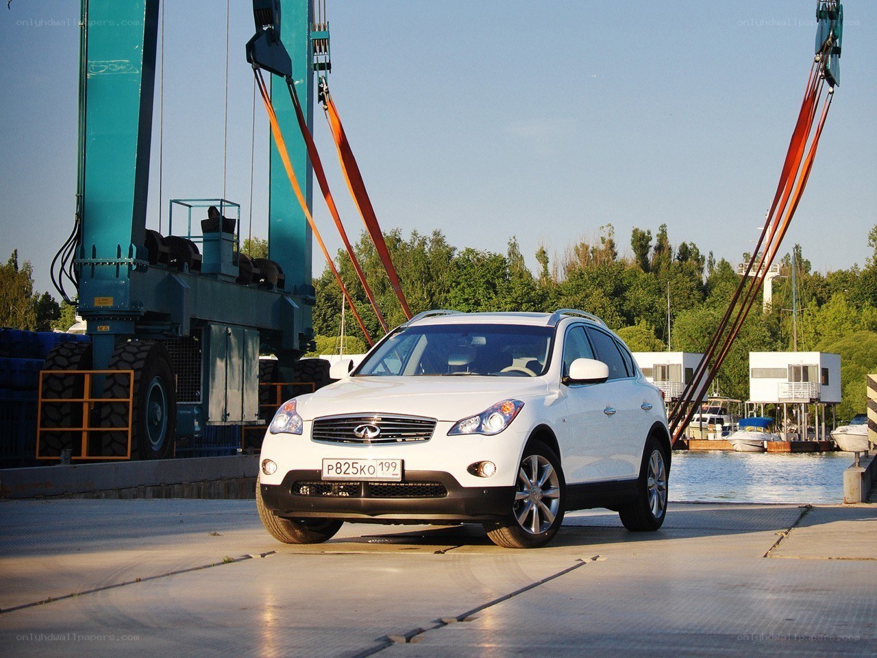 White Infiniti on a dock