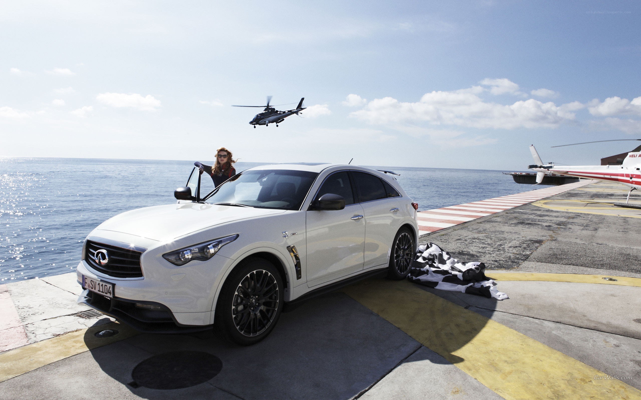 White Infiniti on helipad