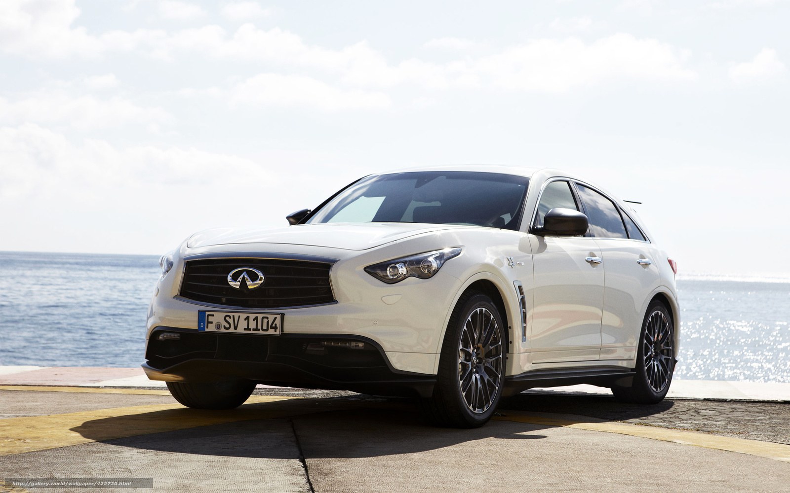White Infiniti QX70 by the sea