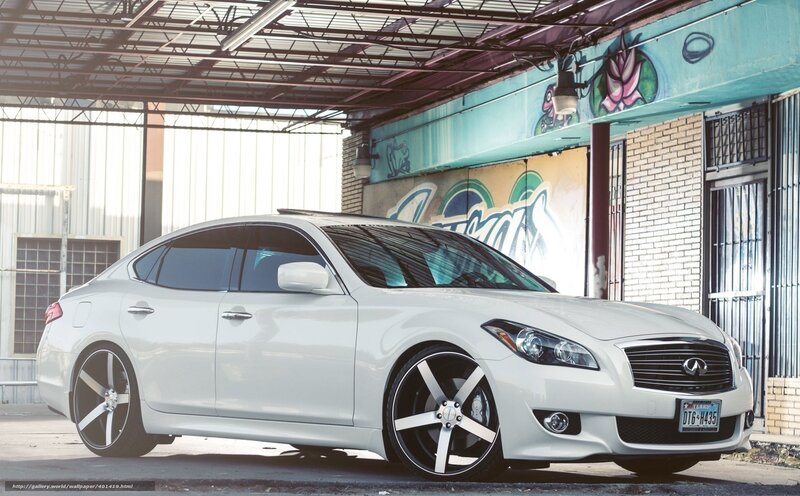 white infiniti sedan in urban setting