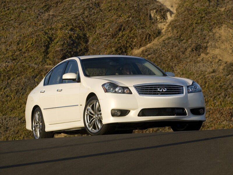 white infiniti sedan on road