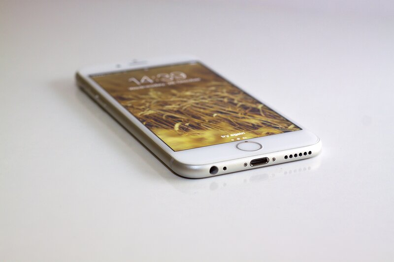 white iPhone on white surface