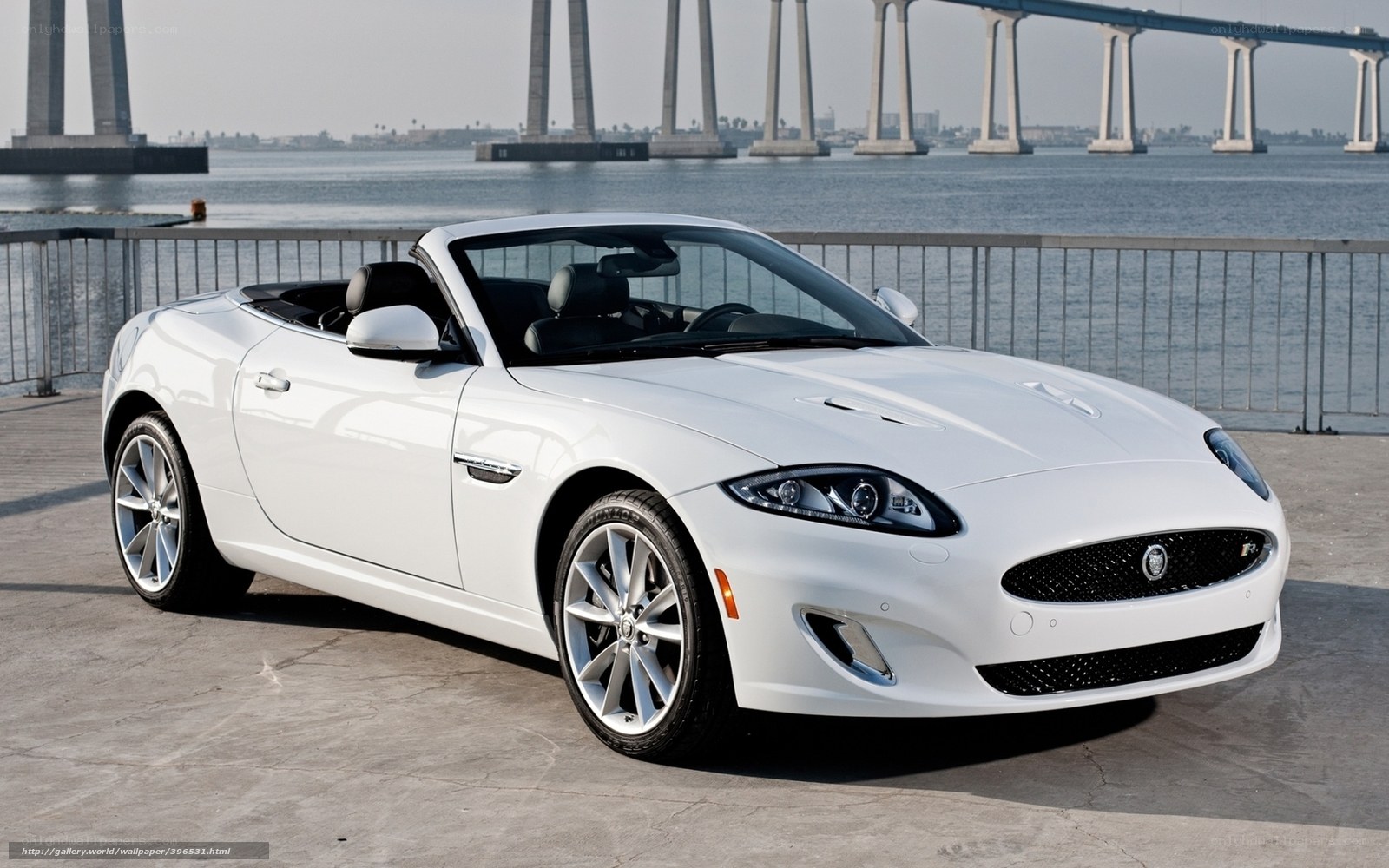 White Jaguar Convertible by Water