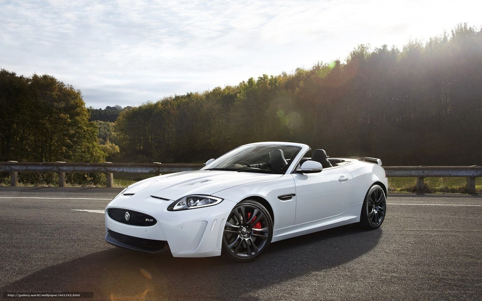 White Jaguar Convertible on Road