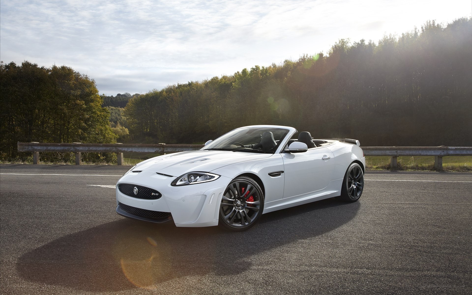 White Jaguar Convertible on Road