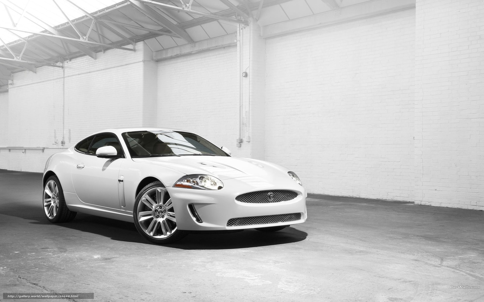 White Jaguar Coupe in Garage