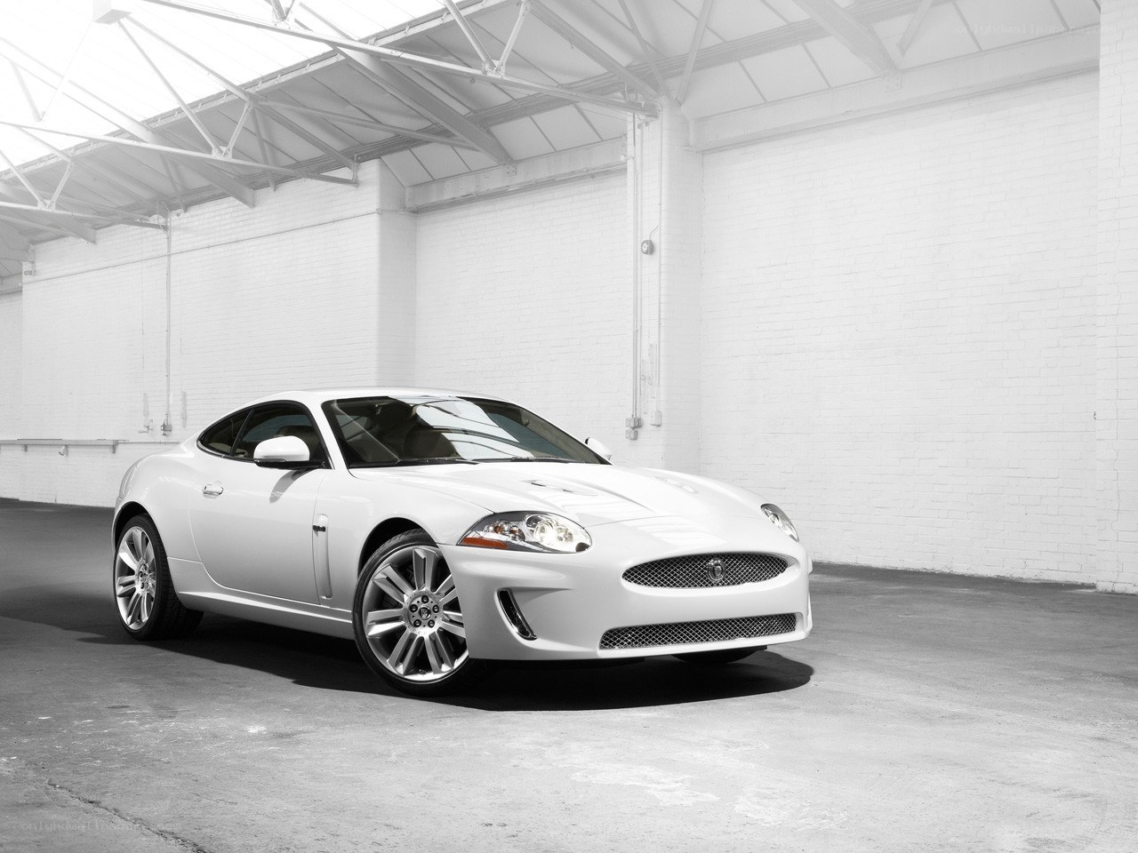White Jaguar Coupe in Warehouse