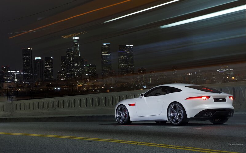 White Jaguar CX-76 on city bridge