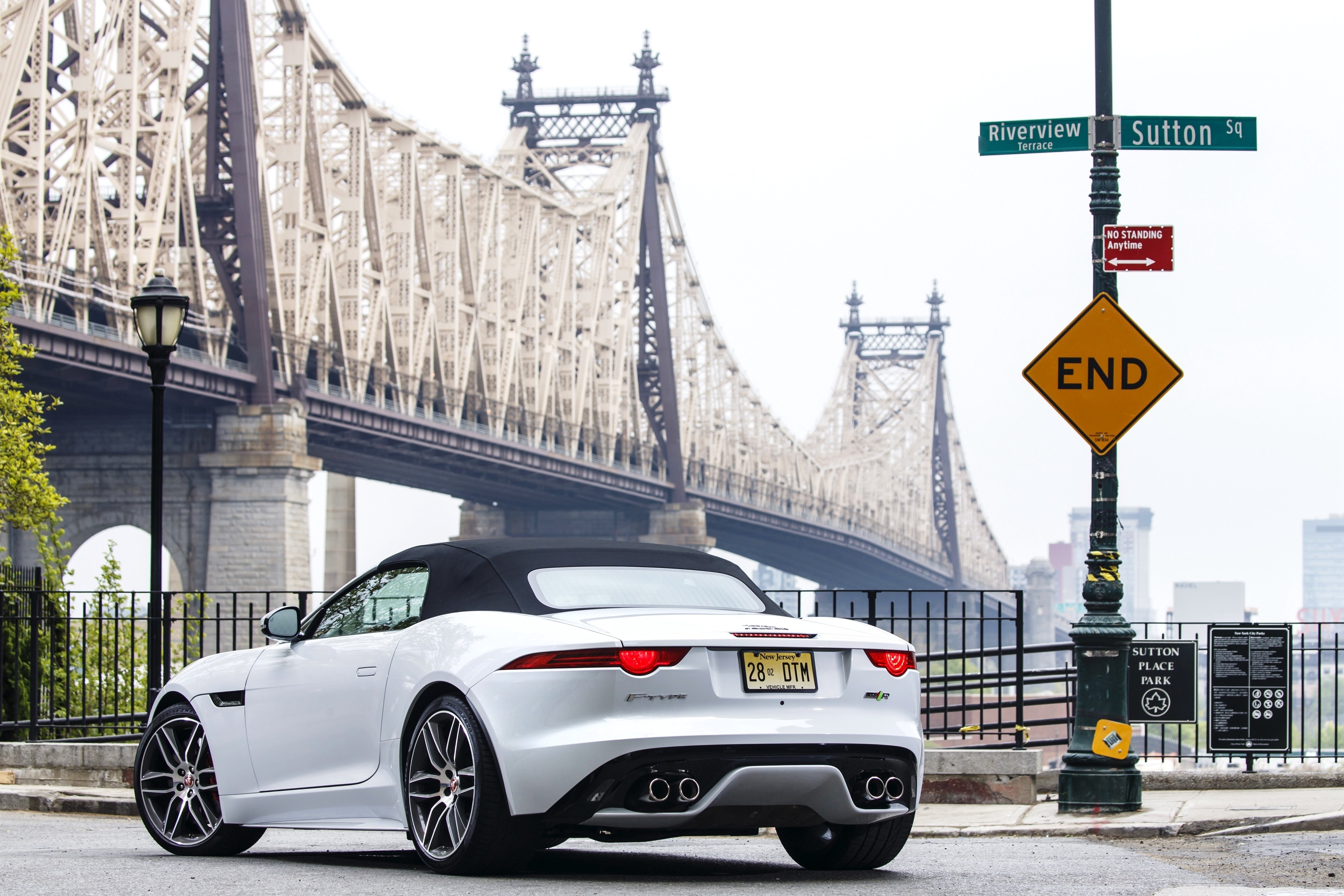 White Jaguar F-Type by a bridge