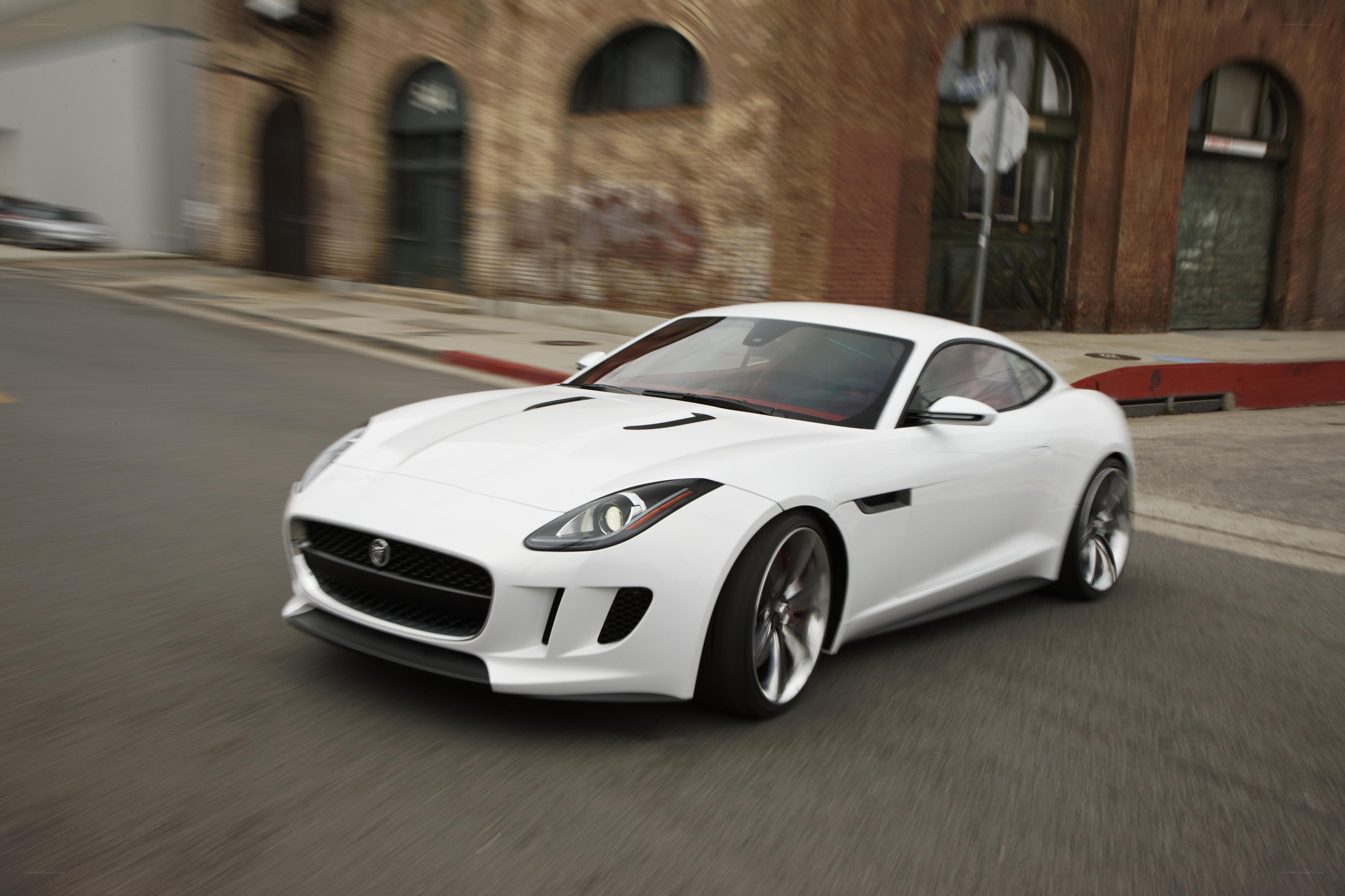 White Jaguar F-Type in motion