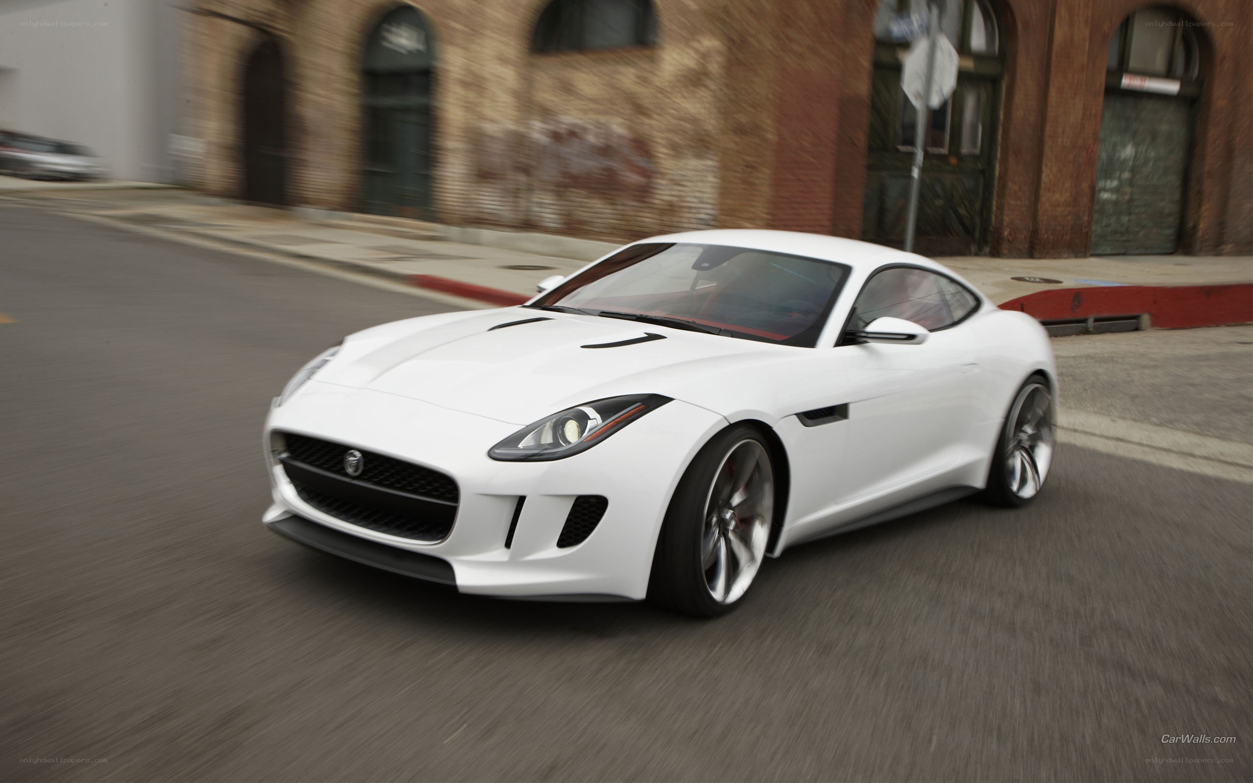 White Jaguar F-Type in motion