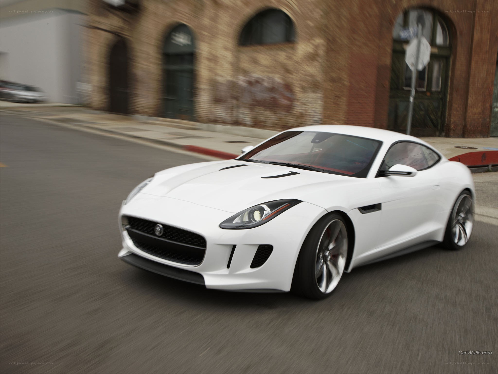 White Jaguar F-Type in motion